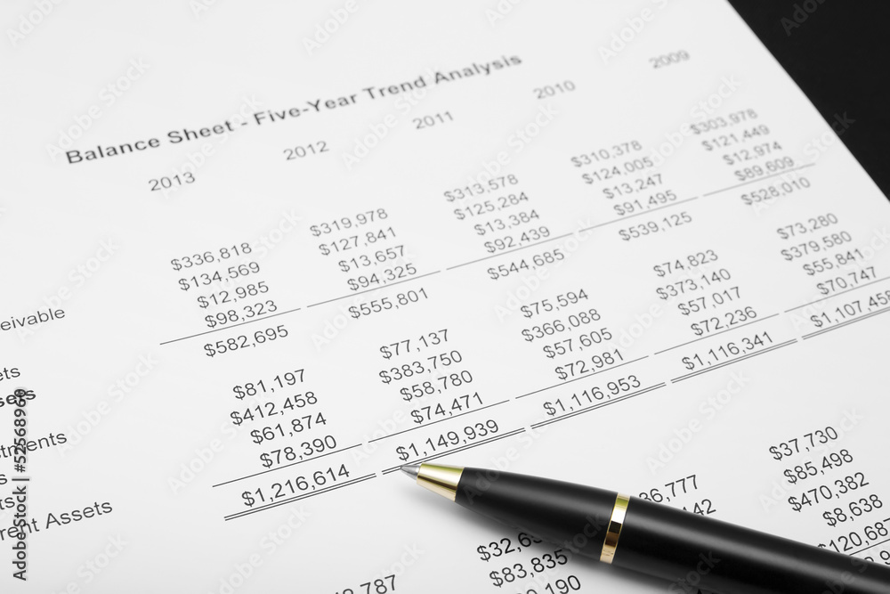business financial chart analysis with pen for investment plan report and number benefit paper business financial chart analysis with pen for investment plan report and number benefit paper