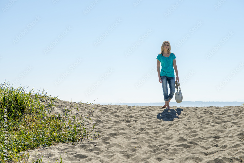 Young Woman Standing On Beach