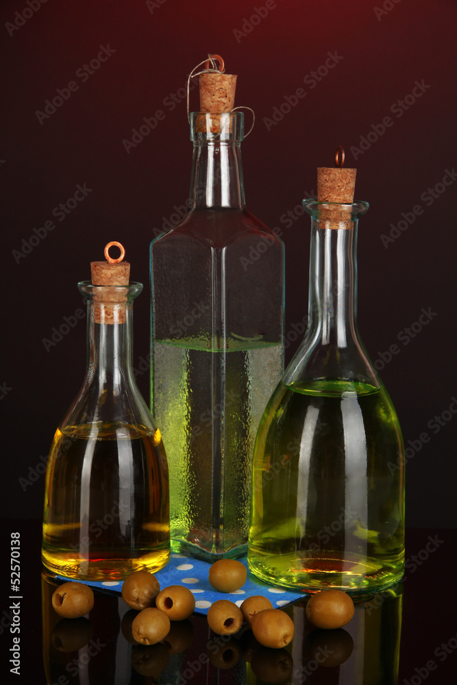 Original glass bottles with oil on dark color background