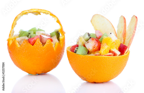 Fototapeta Naklejka Na Ścianę i Meble -  Fruit salad in hollowed-out orange isolated on white