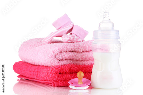 Bottle for milk with towels and nipple isolated on white