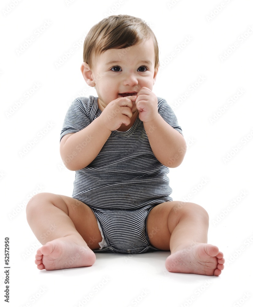 Baby is sitting on floor, isolated on white Baby is sitting on floor, isolated on white