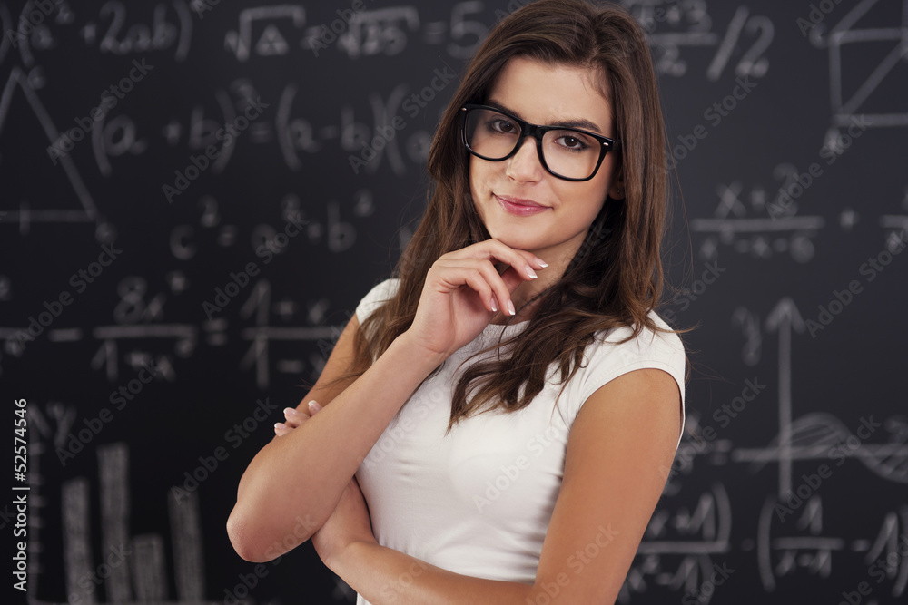 Portrait of beautiful female student wearing on glasses Portrait of beautiful female student wearing on glasses
