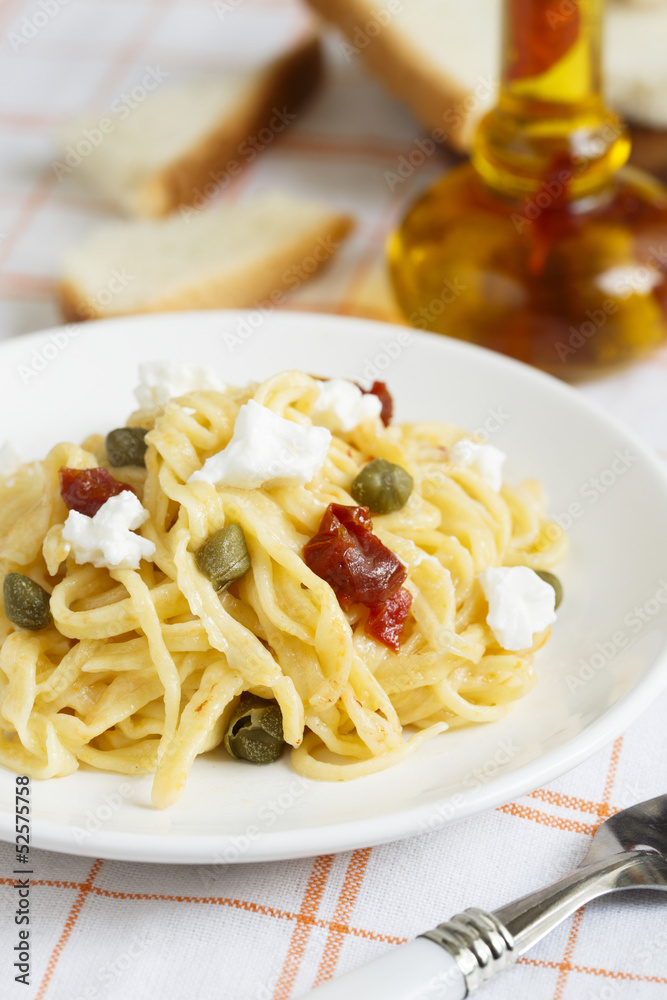Carrot pasta with goat cheese, sun dried tomatoes and capers Carrot pasta with goat cheese, sun dried tomatoes and capers