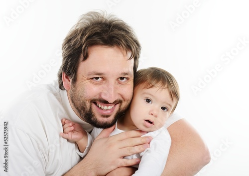 Happy young man holding a smiling 4-5 months old baby, isolated