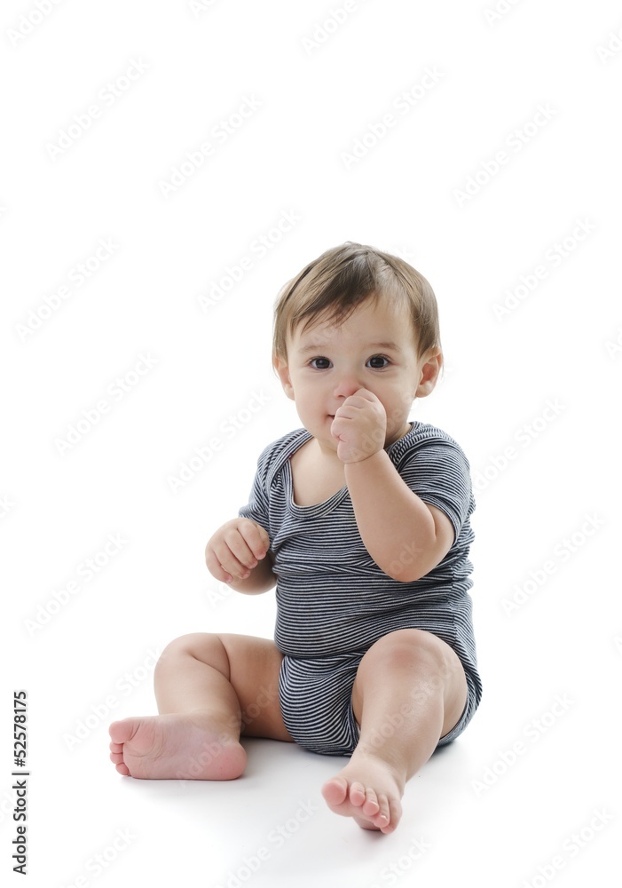 Baby is sitting on floor, isolated on white Baby is sitting on floor, isolated on white