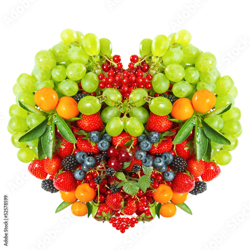 heart shaped mix of fruits and berries on white