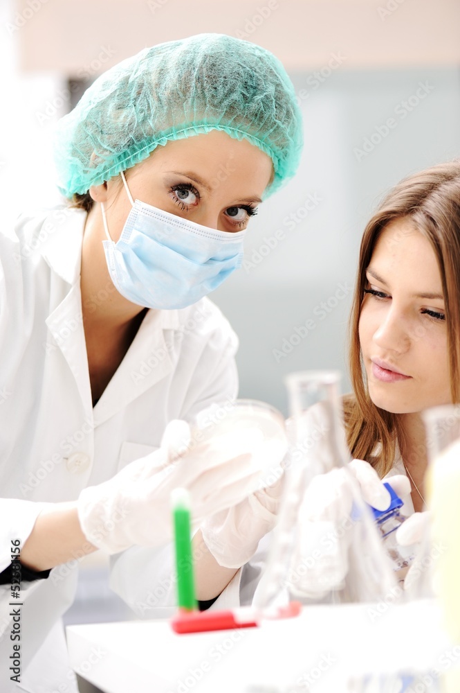 Young science workers research at medical lab Young science workers research at medical lab