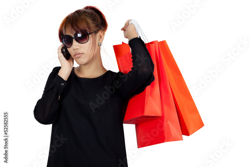 Young asian woman carries shopping bags