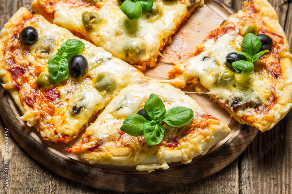 Closeup of freshly baked pizza with cheese Closeup of freshly baked pizza with cheese