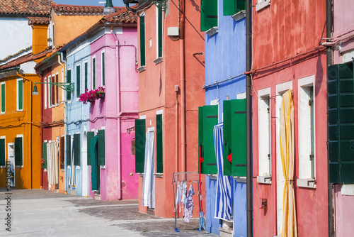 Sunny street with colourful...