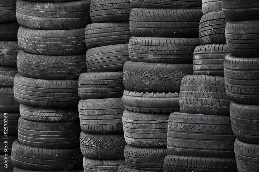 Old used stacked tires background Old used stacked tires background
