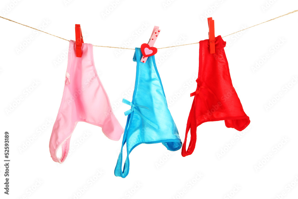 Women's panties hanging on rope isolated on white Women's panties hanging on rope isolated on white