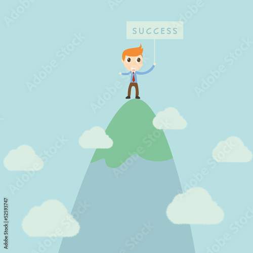 Businessman standing on high mountain