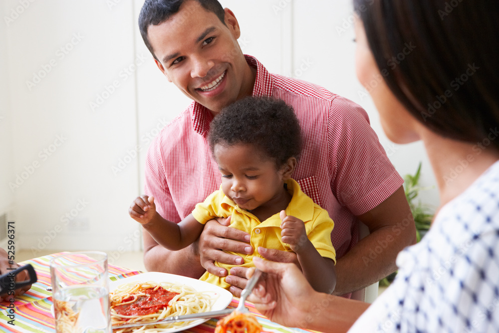 Family Eating Meal Together At Home Family Eating Meal Together At Home