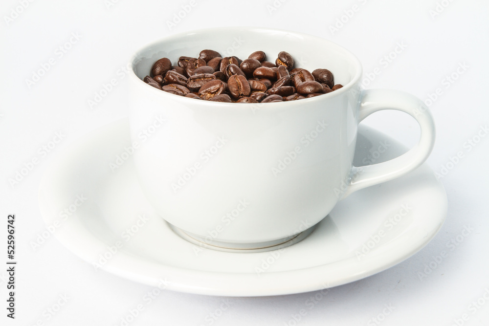 Coffee cup and coffee beans isolated on white Coffee cup and coffee beans isolated on white