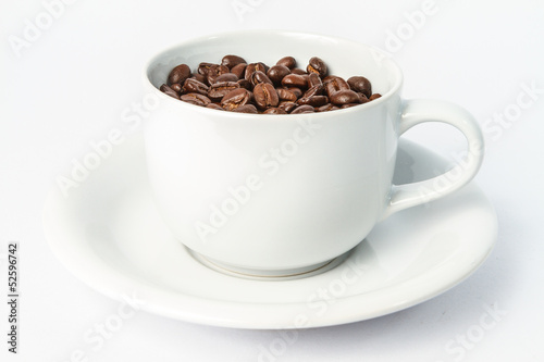 Coffee cup and coffee beans isolated on white