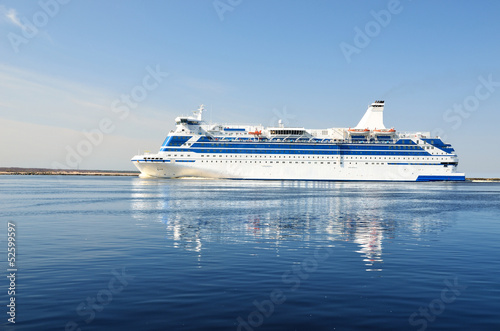 cruise ferry ship sailing in still water