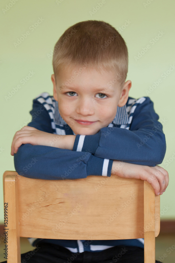 Portrait of a boy in the studio (sitting on a chair) Portrait of a boy in the studio (sitting on a chair)