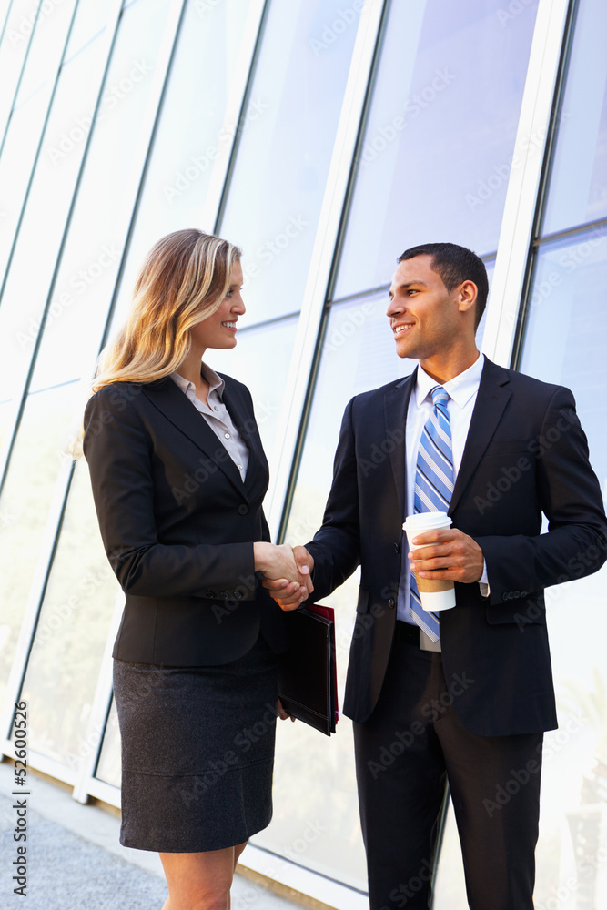 Businessman And Businesswomen Shaking Hands Outside Office Businessman And Businesswomen Shaking Hands Outside Office