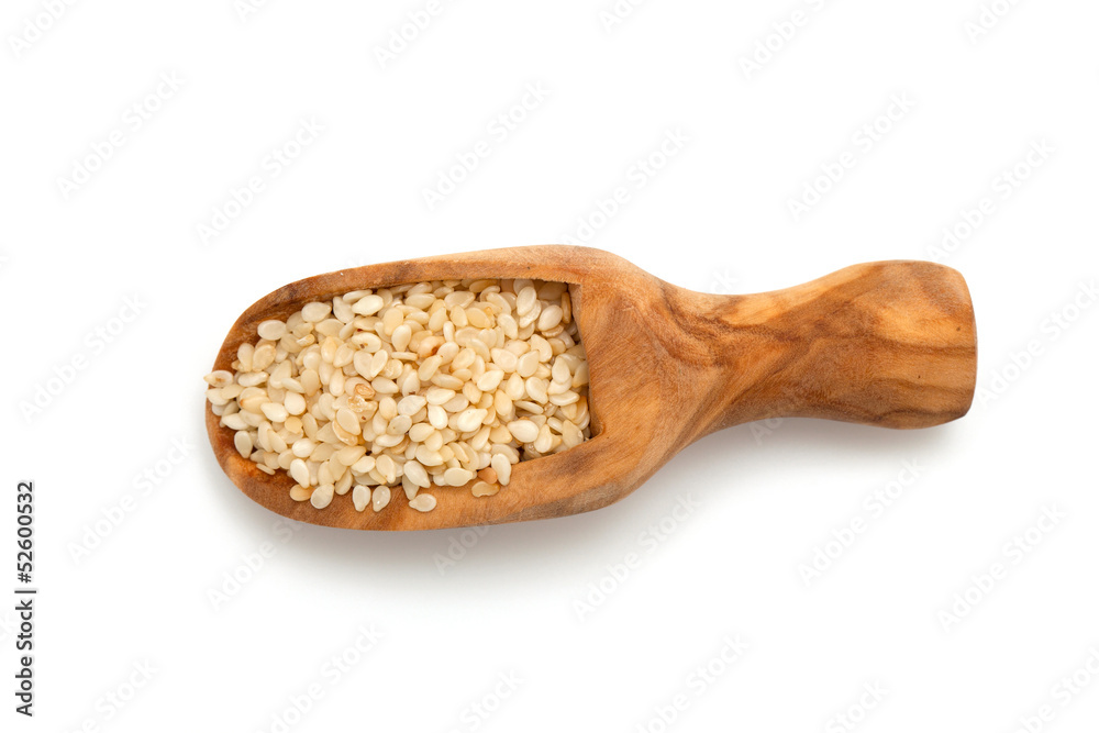sesame seeds in a wooden scoop sesame seeds in a wooden scoop