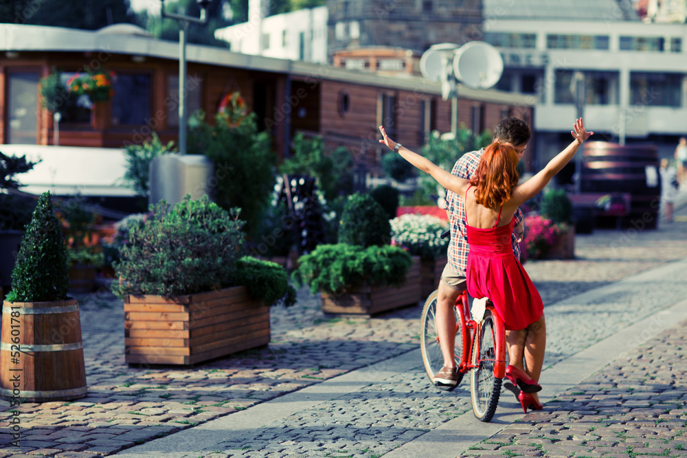 Couple have fun riding on bike