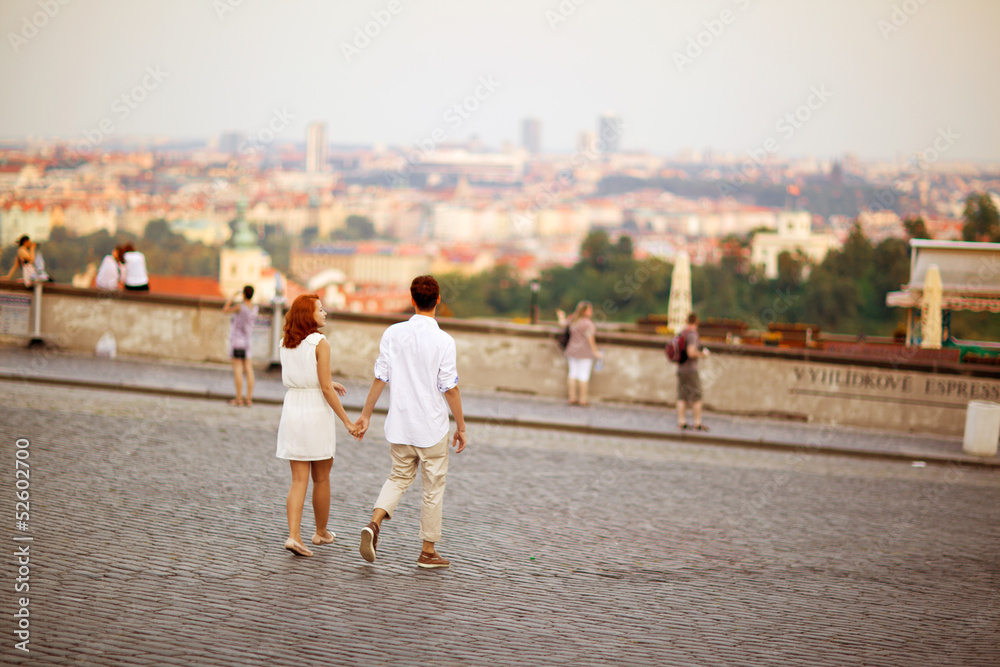 Young couple walking in old town of Prague