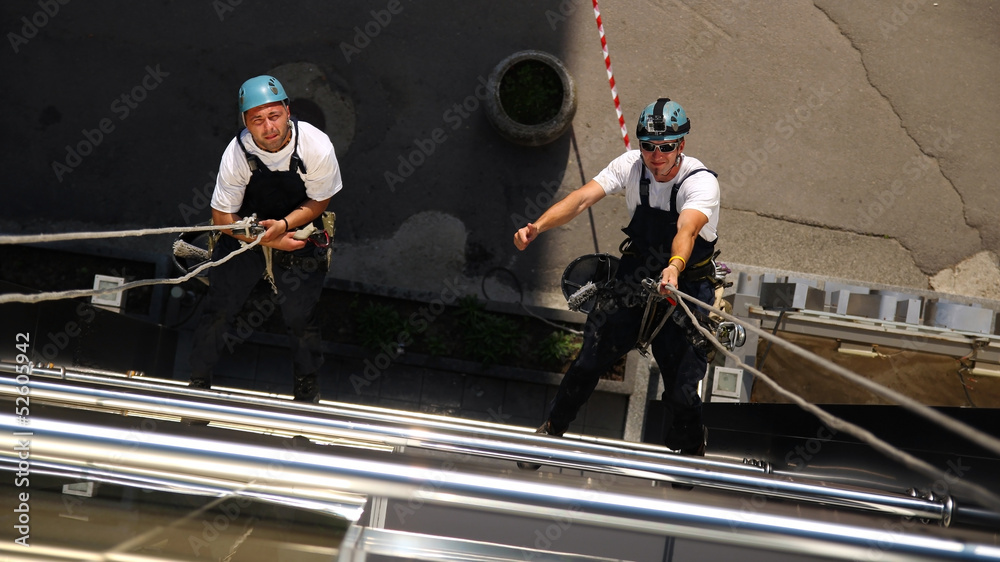 Two Climbers Working on Heights