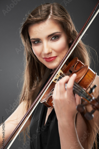 Music violin. Female face close up.