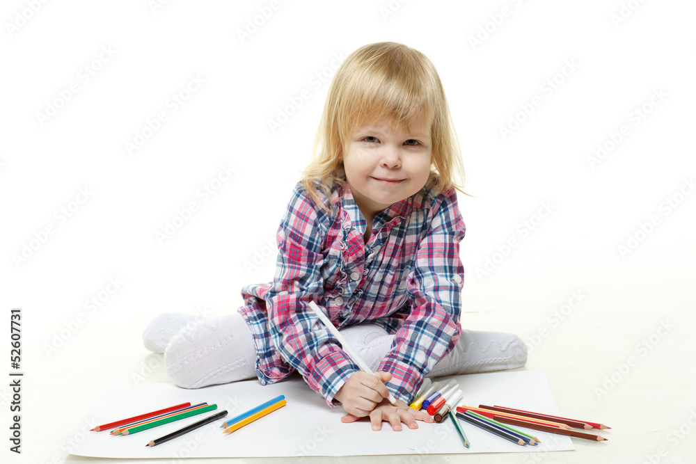 Happy little girl draws a picture. Happy little girl draws a picture.