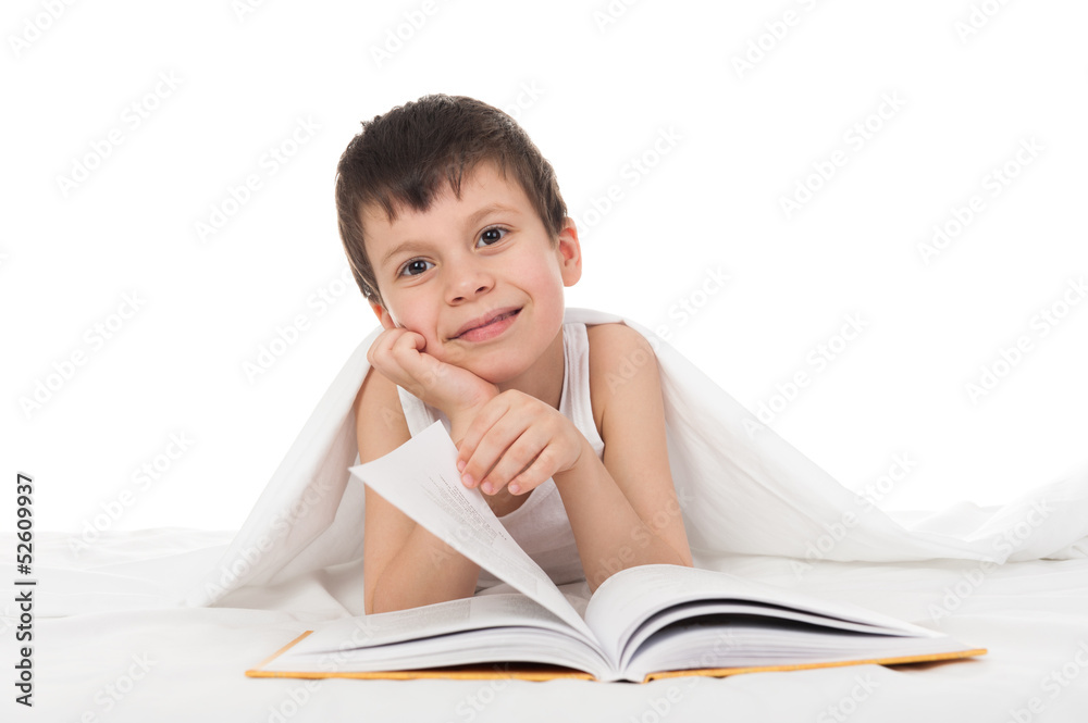 boy read a book in bed boy read a book in bed