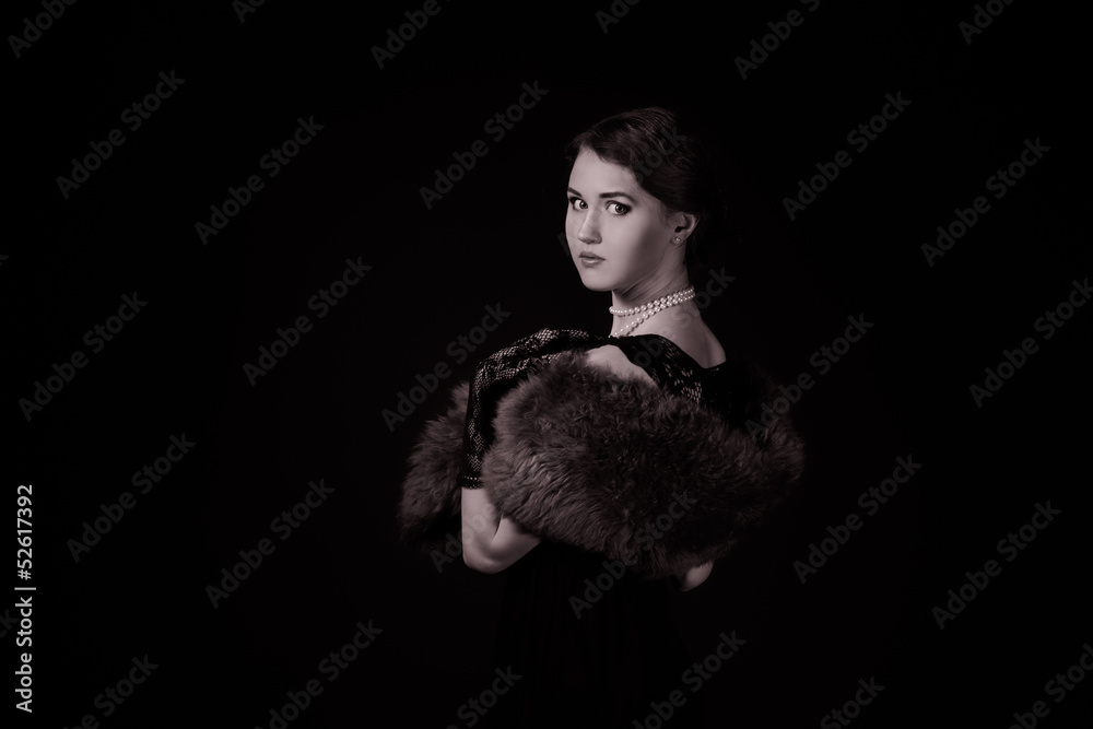 The girl in the retro image of a black background The girl in the retro image of a black background