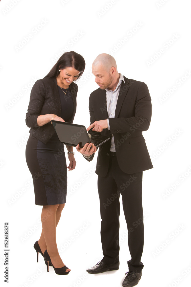 Businesswoman and businessman looking at laptop Businesswoman and businessman looking at laptop
