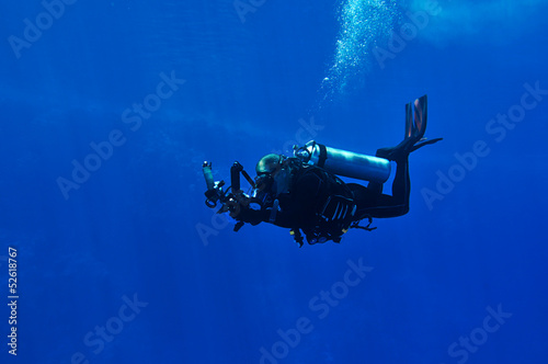 Fototapeta Naklejka Na Ścianę i Meble -  Diver taking photo underwater