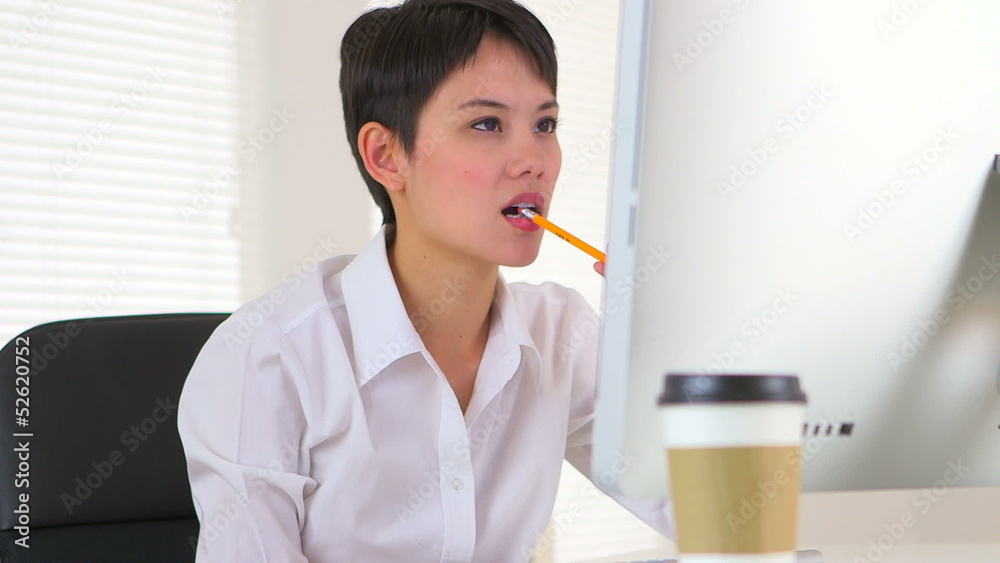 Happy Chinese businesswoman working
