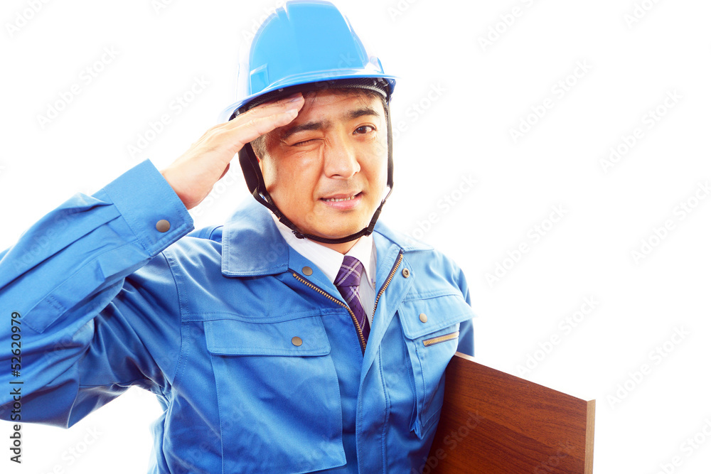 疲れた表情の作業員 疲れた表情の作業員