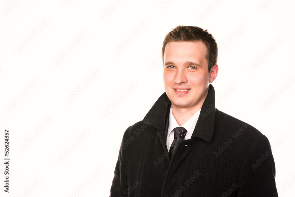 Handsome young businessman in a coat isolated Handsome young businessman in a coat isolated