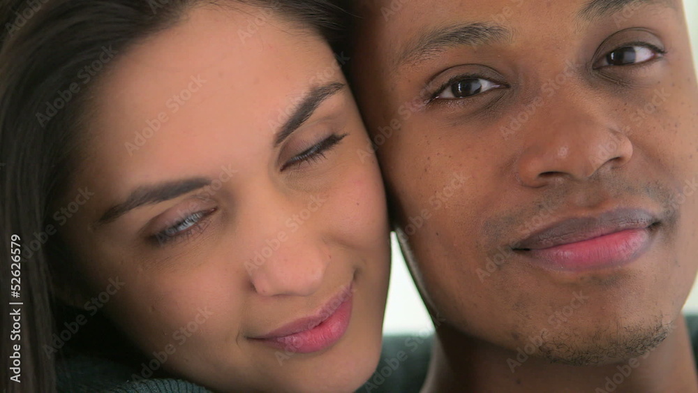 Happy African American and Caucasian couple smiling Happy African American and Caucasian couple smiling