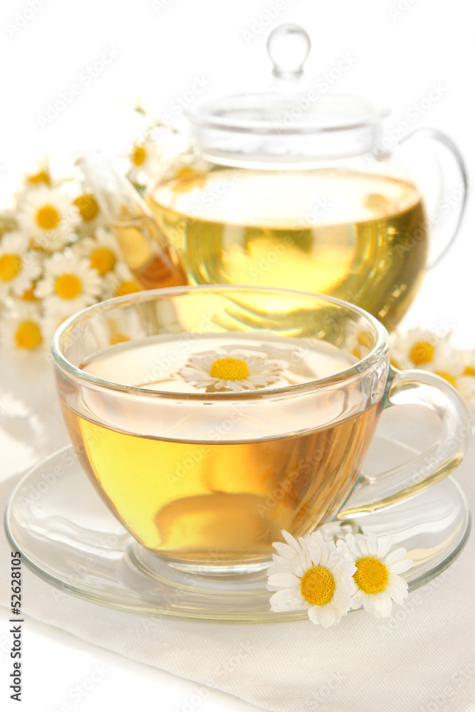 Cup of herbal tea with camomiles close up Cup of herbal tea with camomiles close up