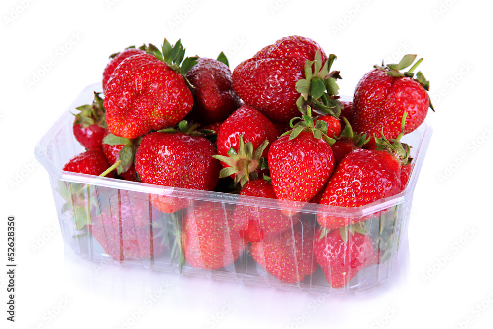 Strawberries in plastic box isolated on white Strawberries in plastic box isolated on white