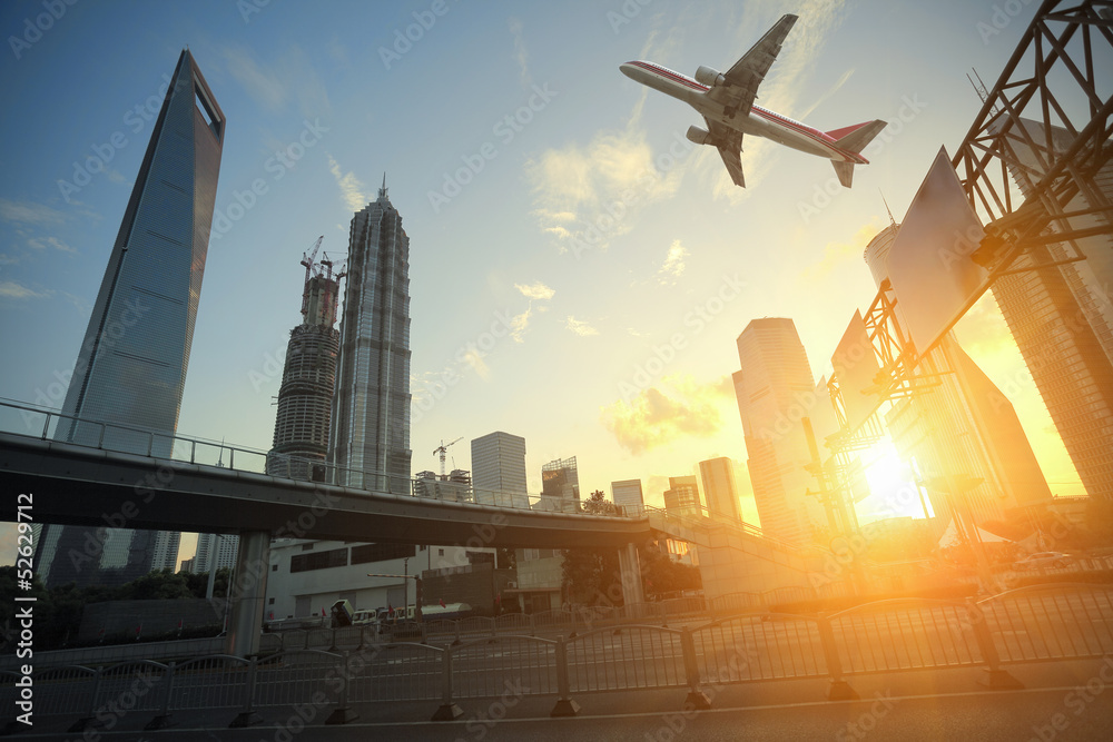Shanghai,Aircraft is flying in the modern urban buildings Shanghai,Aircraft is flying in the modern urban buildings