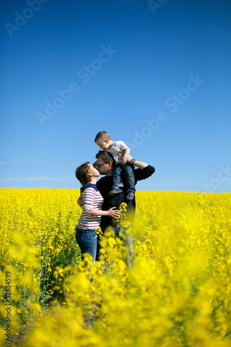 happy family in blooming field