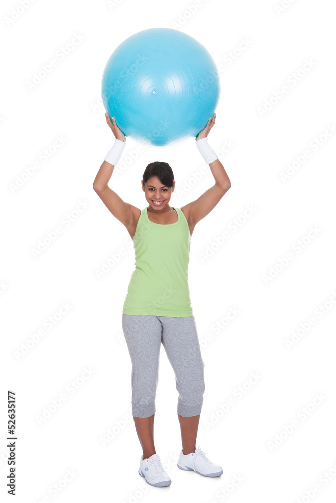 Young Woman Exercising With Pilates Ball Young Woman Exercising With Pilates Ball