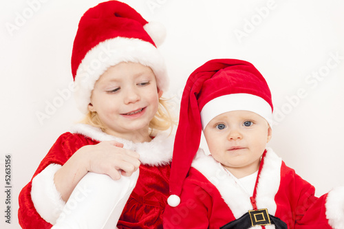 two little girls as Santa Clauses
