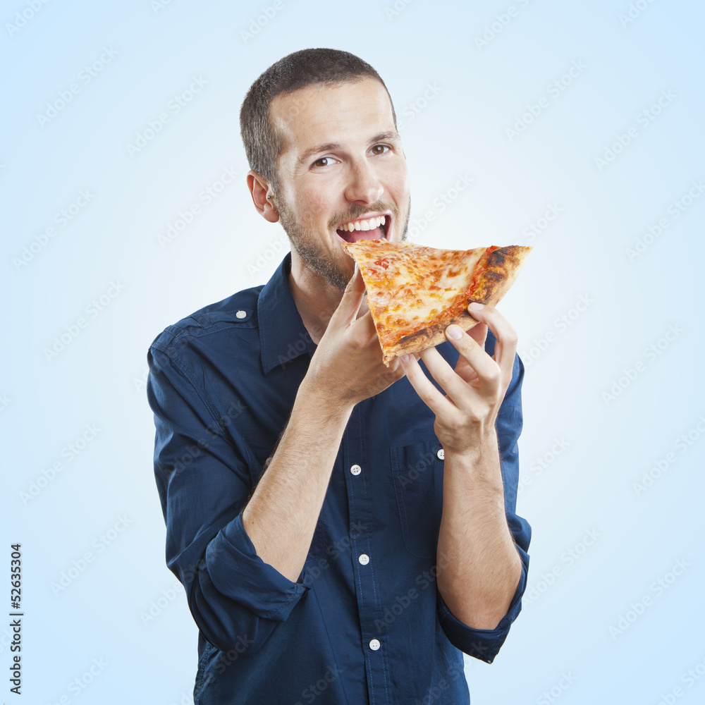 portrait of a young beautiful man eating a slice of pizza marghe portrait of a young beautiful man eating a slice of pizza marghe