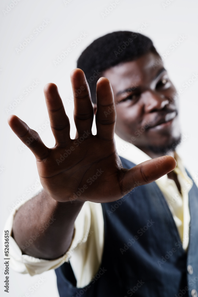 Man holding up his hand in a protest gesture Man holding up his hand in a protest gesture