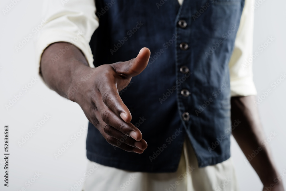 African American man shaking hands with caucasian man