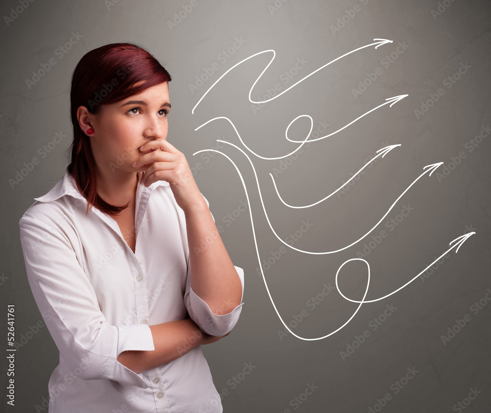 Attractive teenager looking at multiple curly arrows Attractive teenager looking at multiple curly arrows