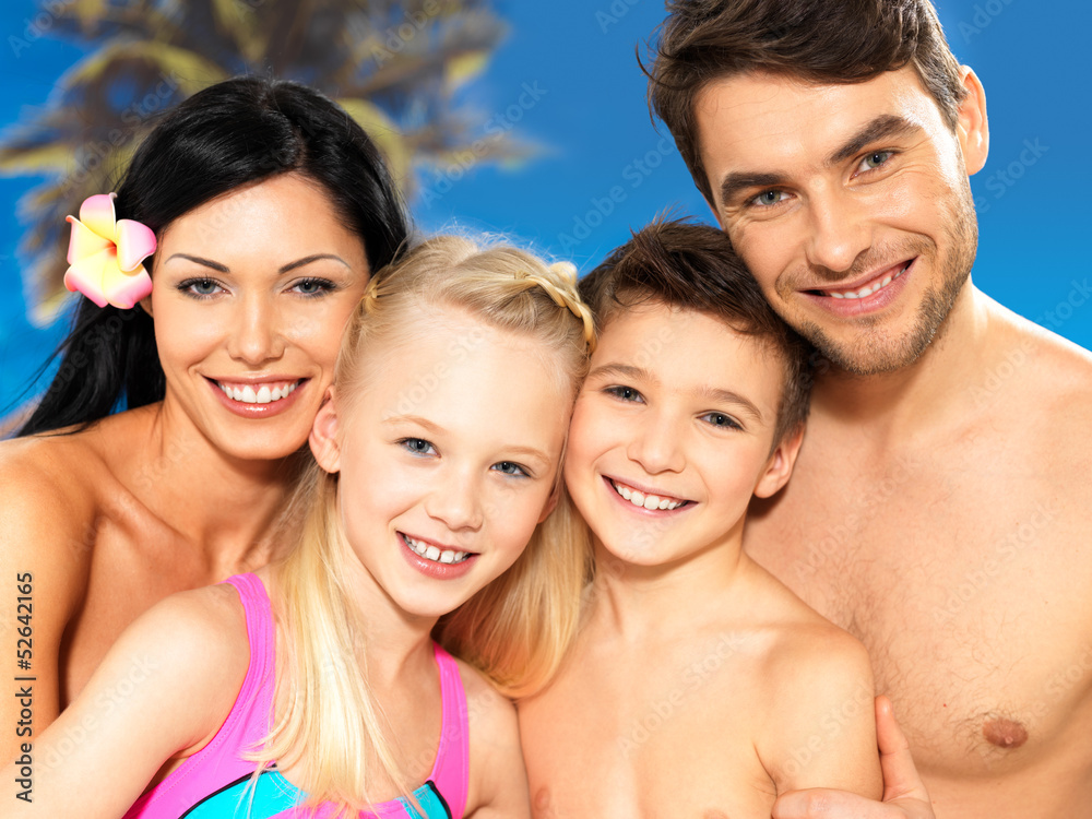 Happy family with two children at tropical beach Happy family with two children at tropical beach