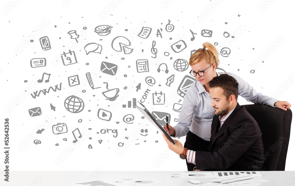 Businessman and businesswoman with all kind of hand-drawn icons Businessman and businesswoman with all kind of hand-drawn icons